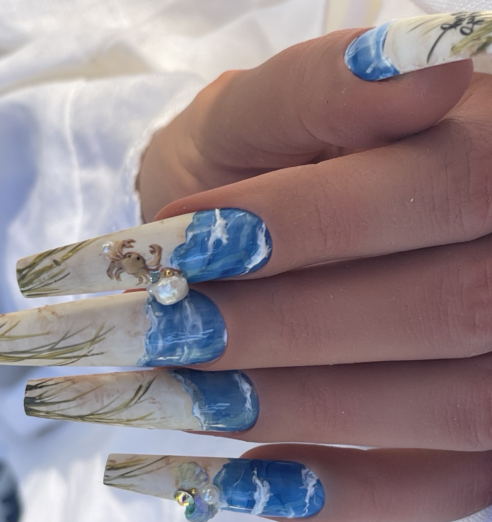 Gorgeous beach nails created with blooming milky ink from beautyfenniquenailsupplies