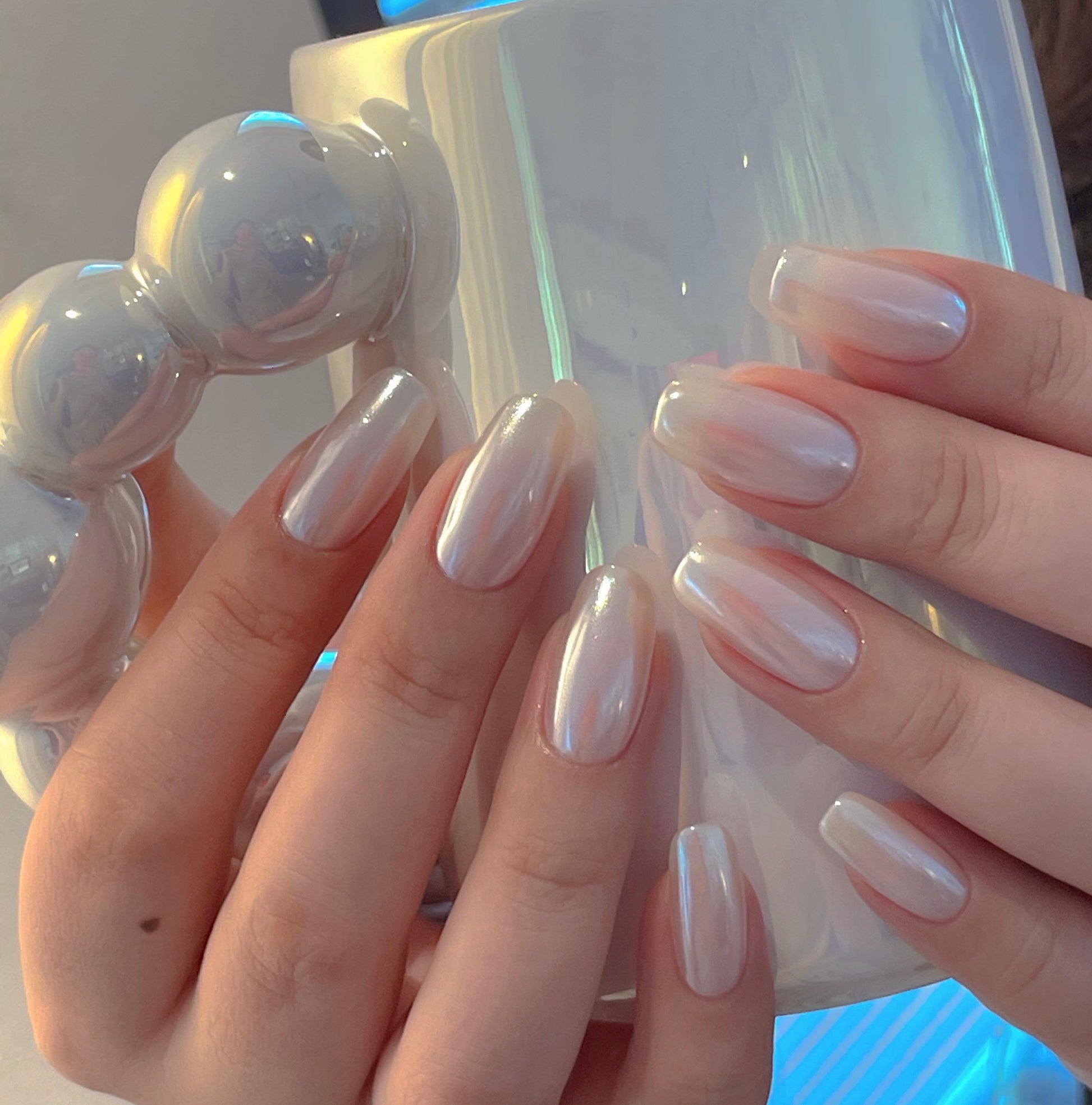 If you loved the glazed donut nail trend— try pearl white chrome